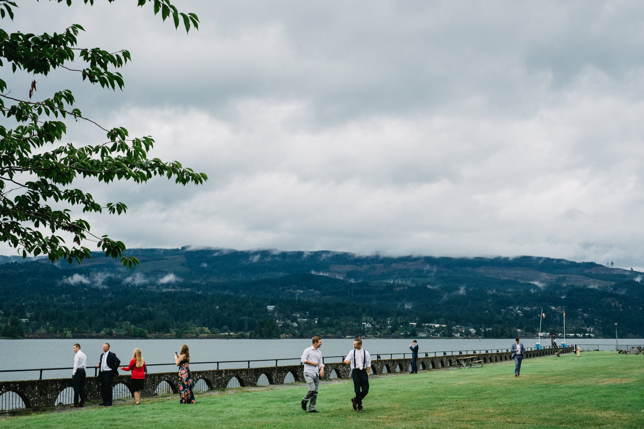  Candid moment of wedding guests enjoying Columbia river at cascade locks 