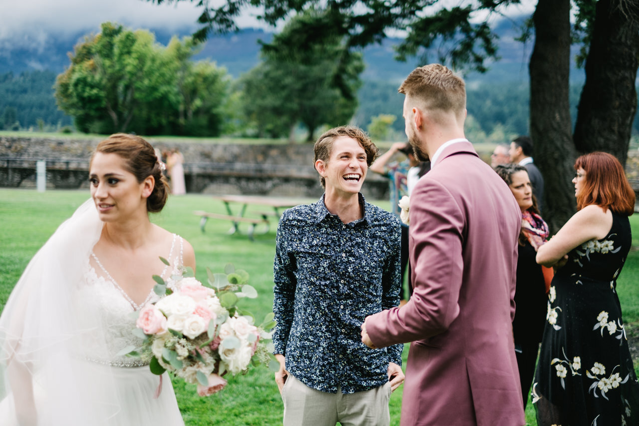  Wedding guest smiles at groom 