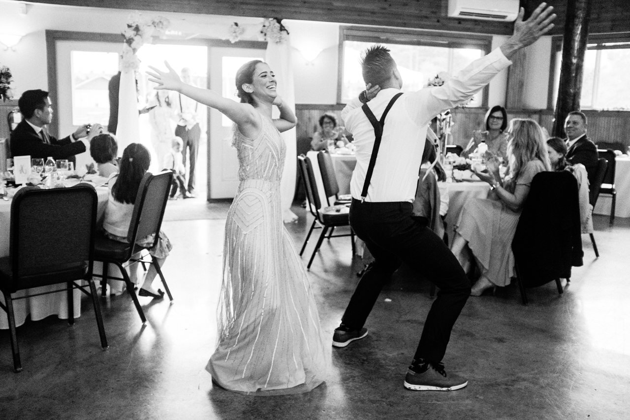  Bridesmaid and groomsman do sprinkler dance after entering reception 