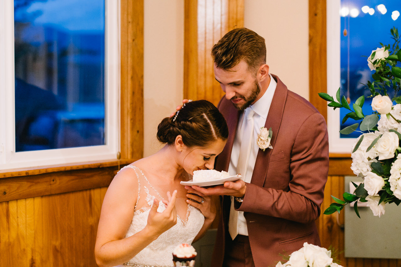  Groom dips cake on brides nose 