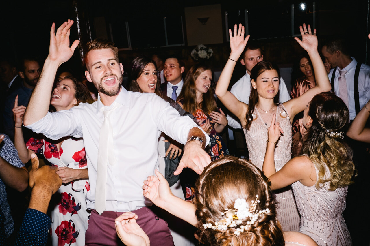  Groom throws up hands during party 