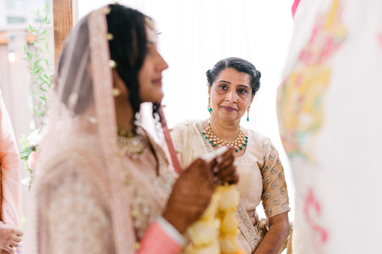  Mother of bride looks at Indian bride before they have met each other 