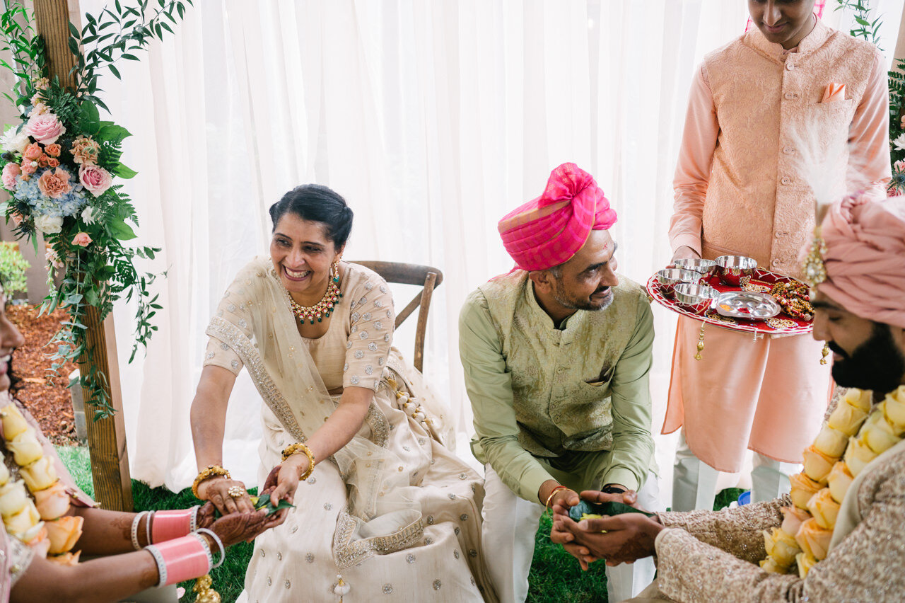  Parents share leaves during Indian wedding ceremony 