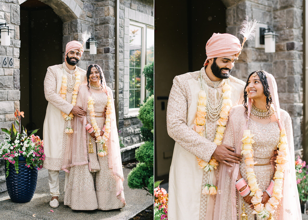  Portrait of indian bride and groom dressed in sari and formal attire in front of home 