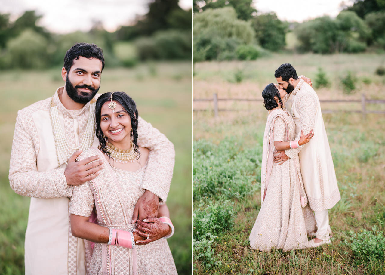  Indian wedding couple dressed in gold and pink embrace in kiss in open field 