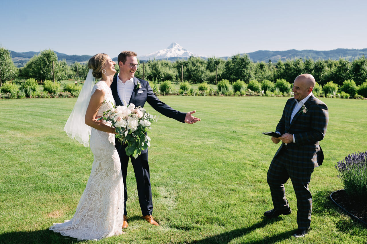  Bride and groom thank officiant at the orchard in mt hood 