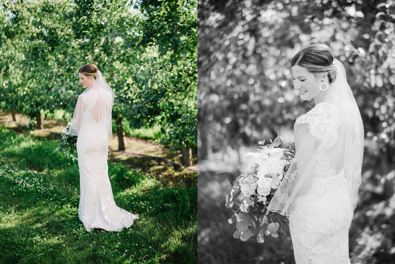  Portrait of the back of brides lace wedding dress in orchard 