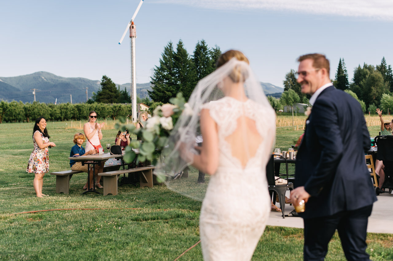  Bride and groom arrive to grateful vineyards for pizza elopement dinner 