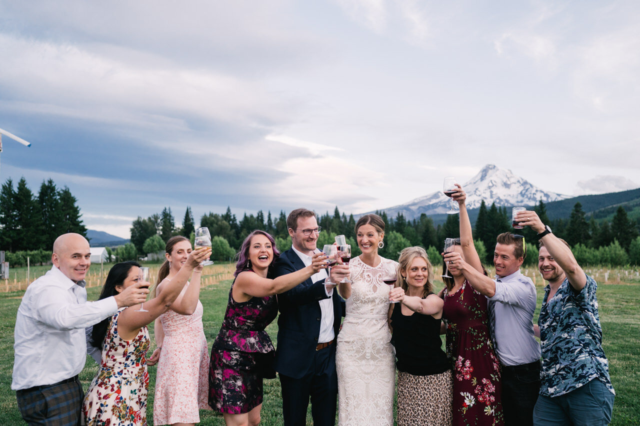  Small wedding group toasts in front of mt hood Oregon 