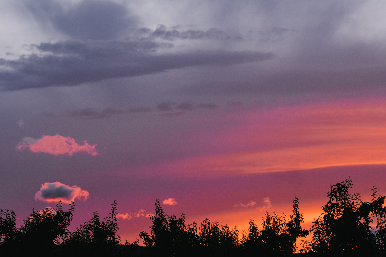  Stunning orange and pink sunset over hood river orchards 