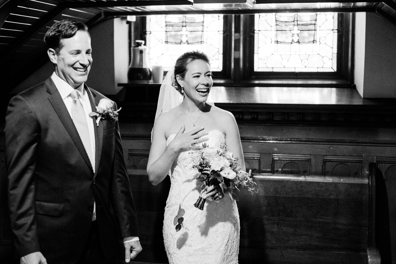  After just married, bride and groom laugh at guests 