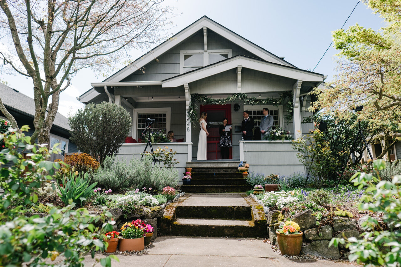  Portland elopement ceremony on front porch with potted plants on the house steps 