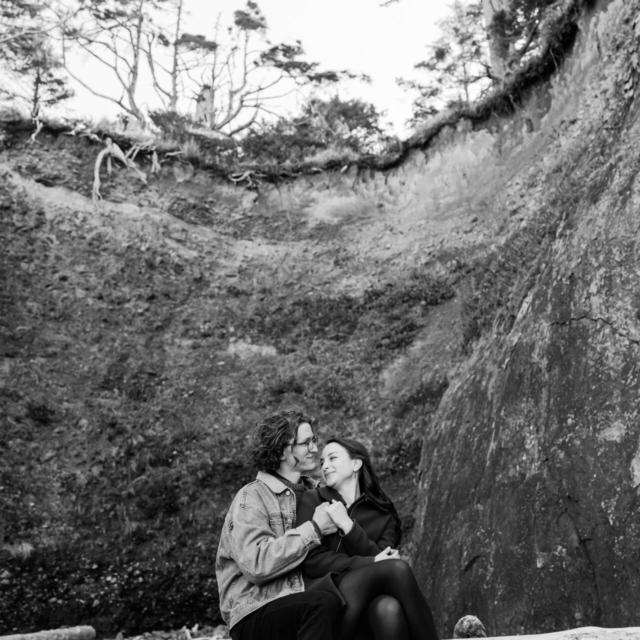  Square black and white photograph of couple in front of Oregon cliffside 
