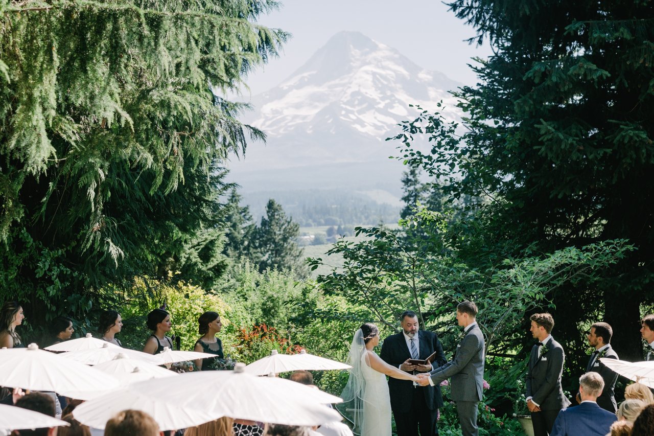  Mt hood peaks behind wedding ceremony at mt hood organic farms 