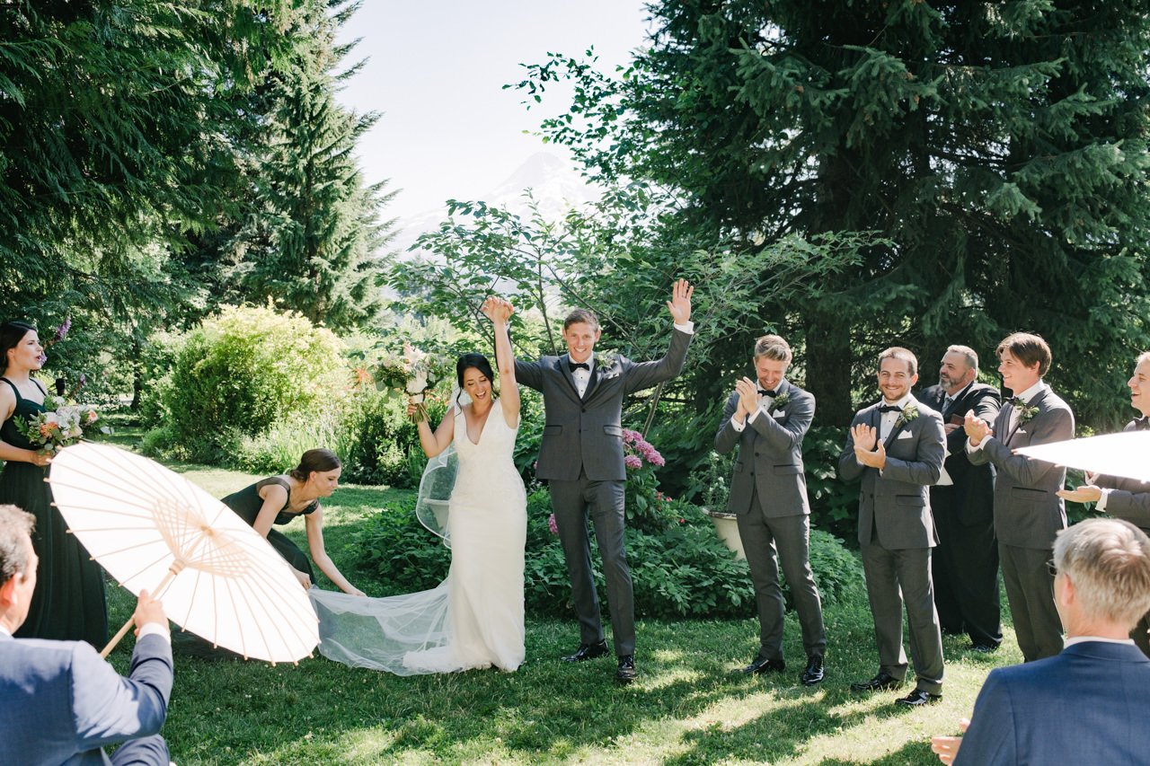  Everyone in wedding cheers after pronouncement of just married at mt hood organic farms 