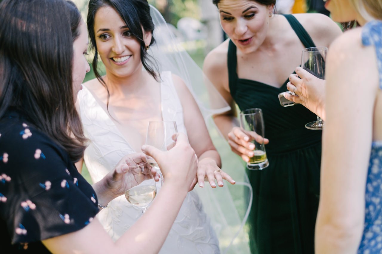  Bride shows off her wedding ring during cocktail hour 