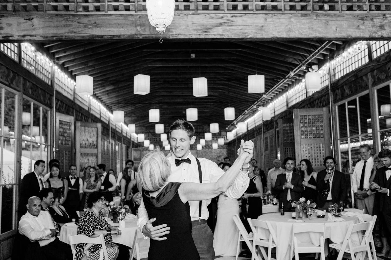  Groom dances with mother in apple house 