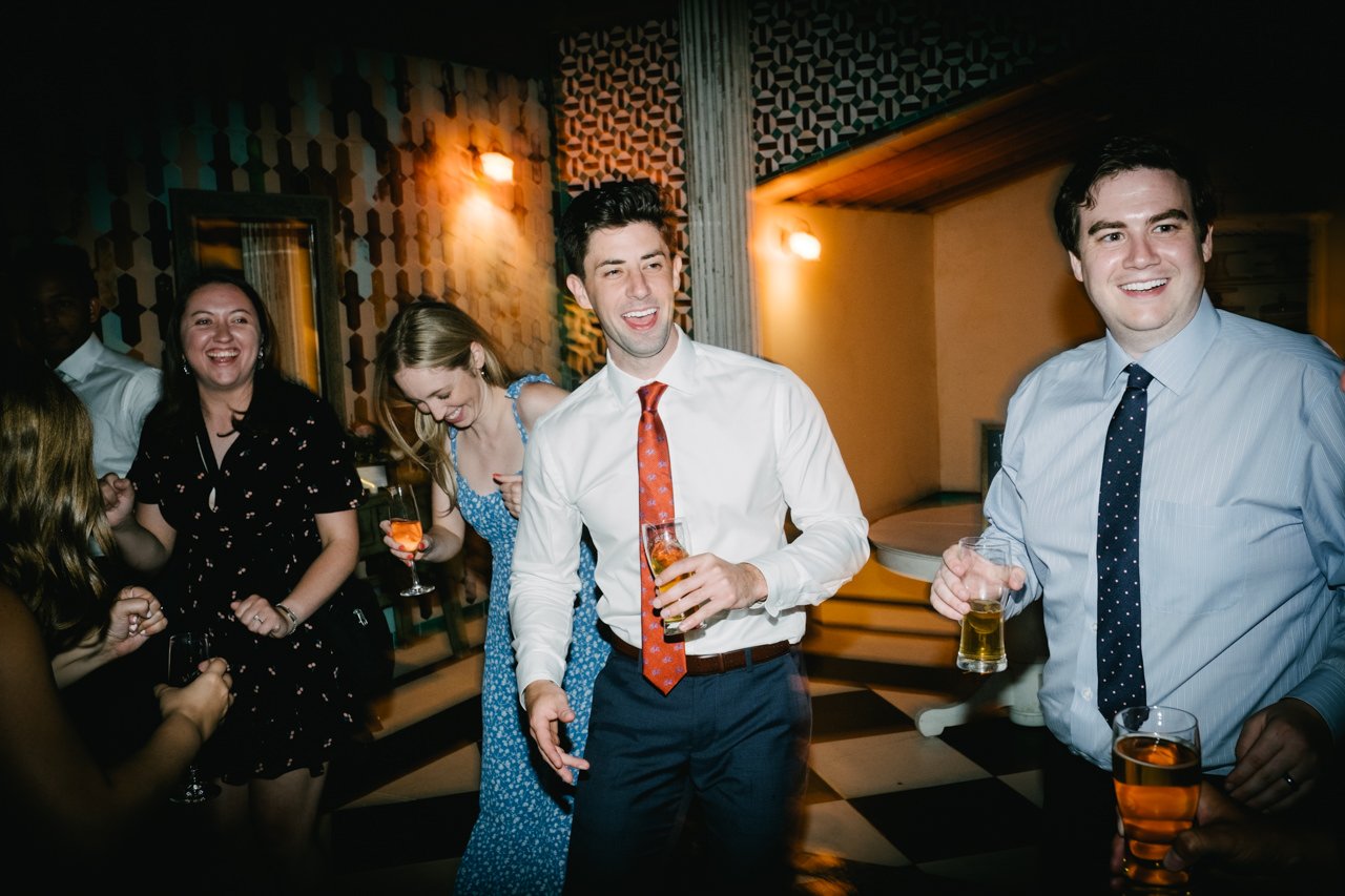  Wedding guests dance during reception party 