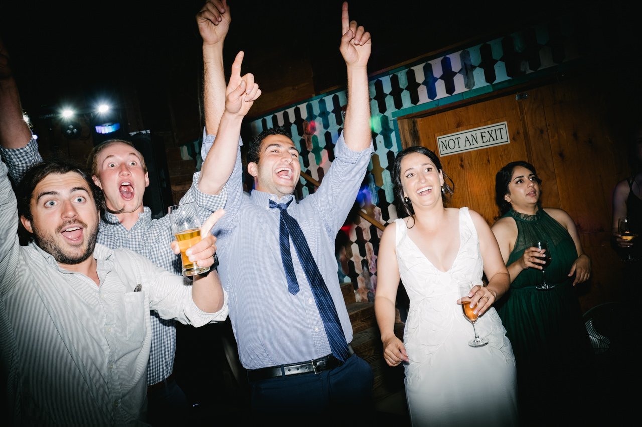  Surprised guests cheer during wedding dance party 