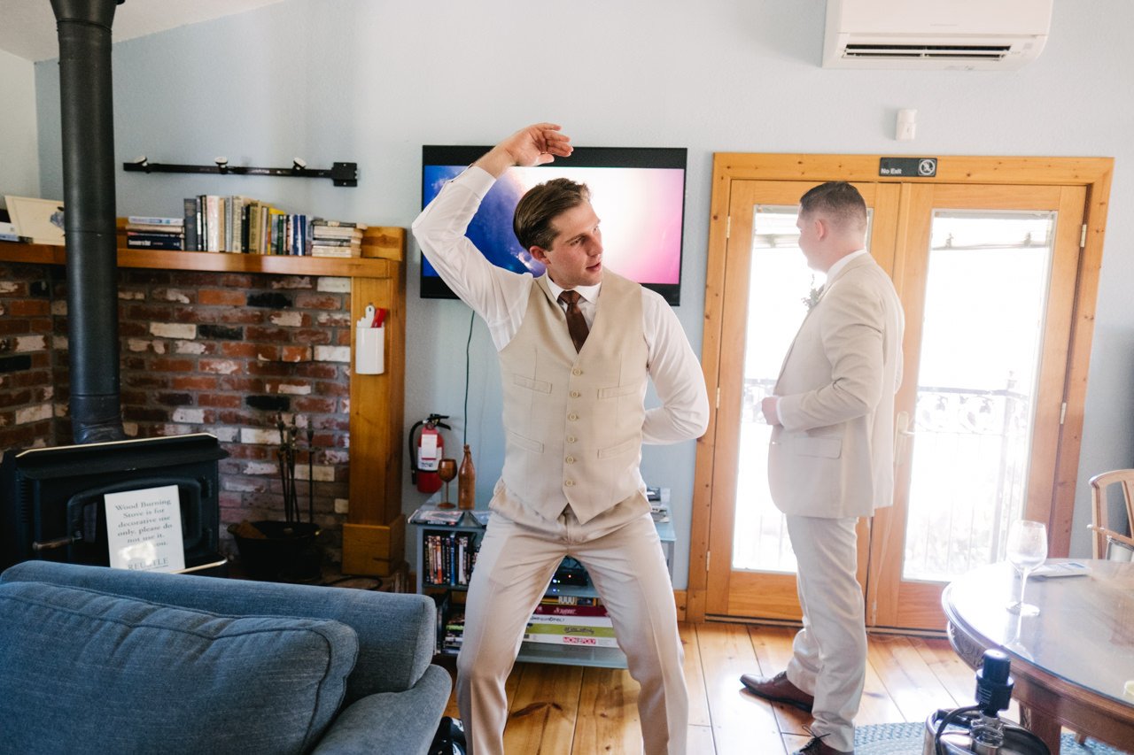  Groom dances with music video playing in background 