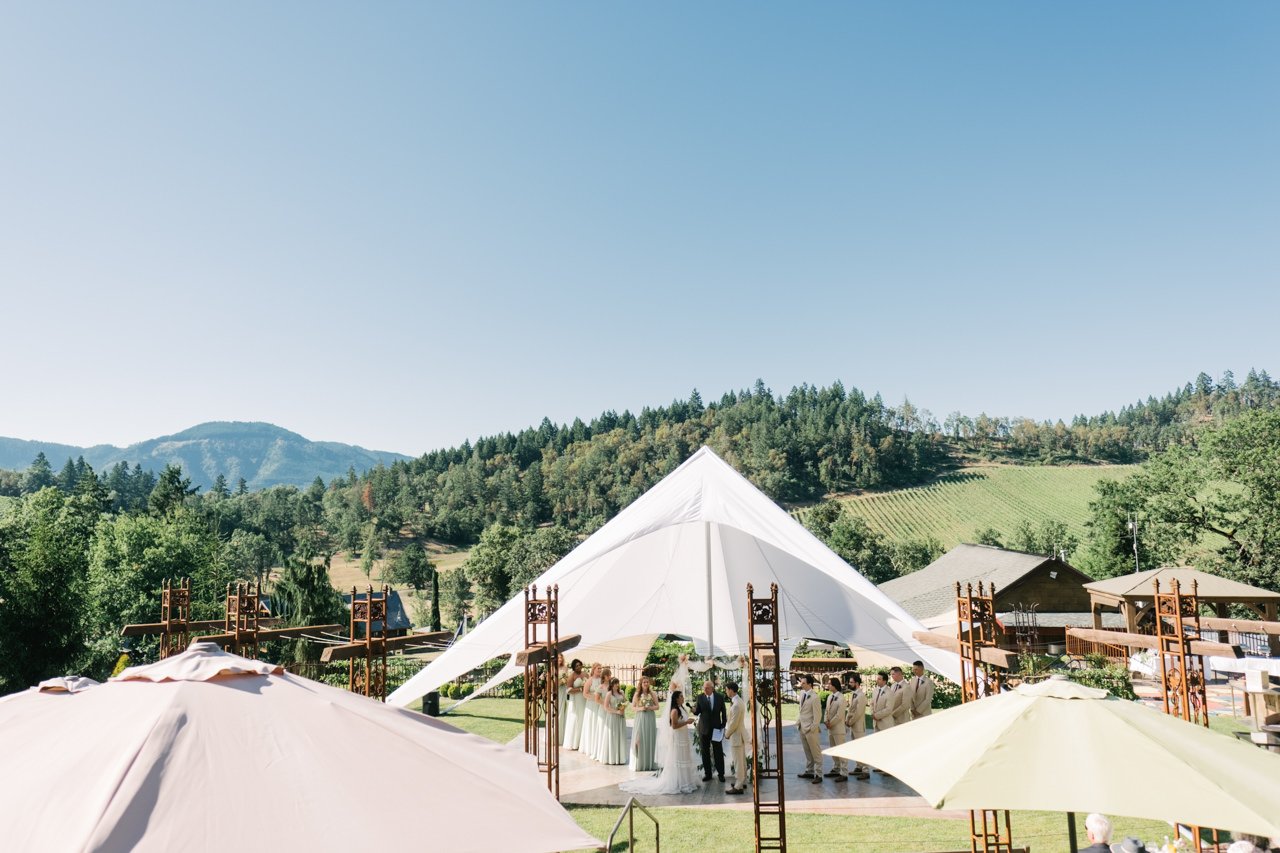  reustle prayer rock vineyard wedding scene over southern Oregon valley and sun tent 