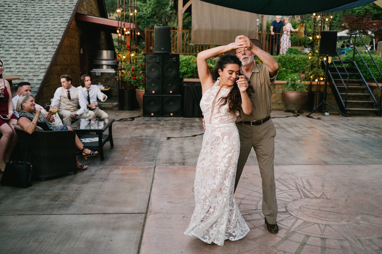  Father spins bride during dance 