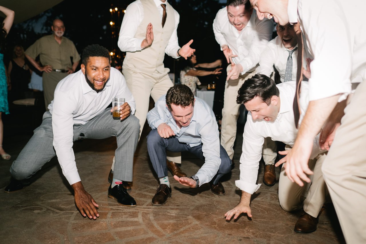  Wedding guests smack the floor during dance party with ties off 