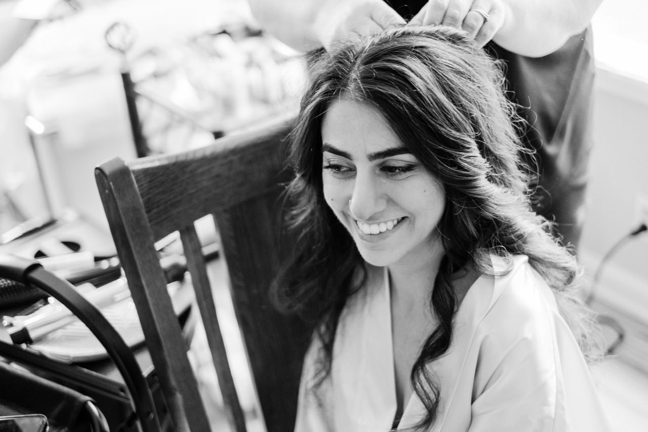  Black and white photo of Turkish bride getting hair prepared for wedding 