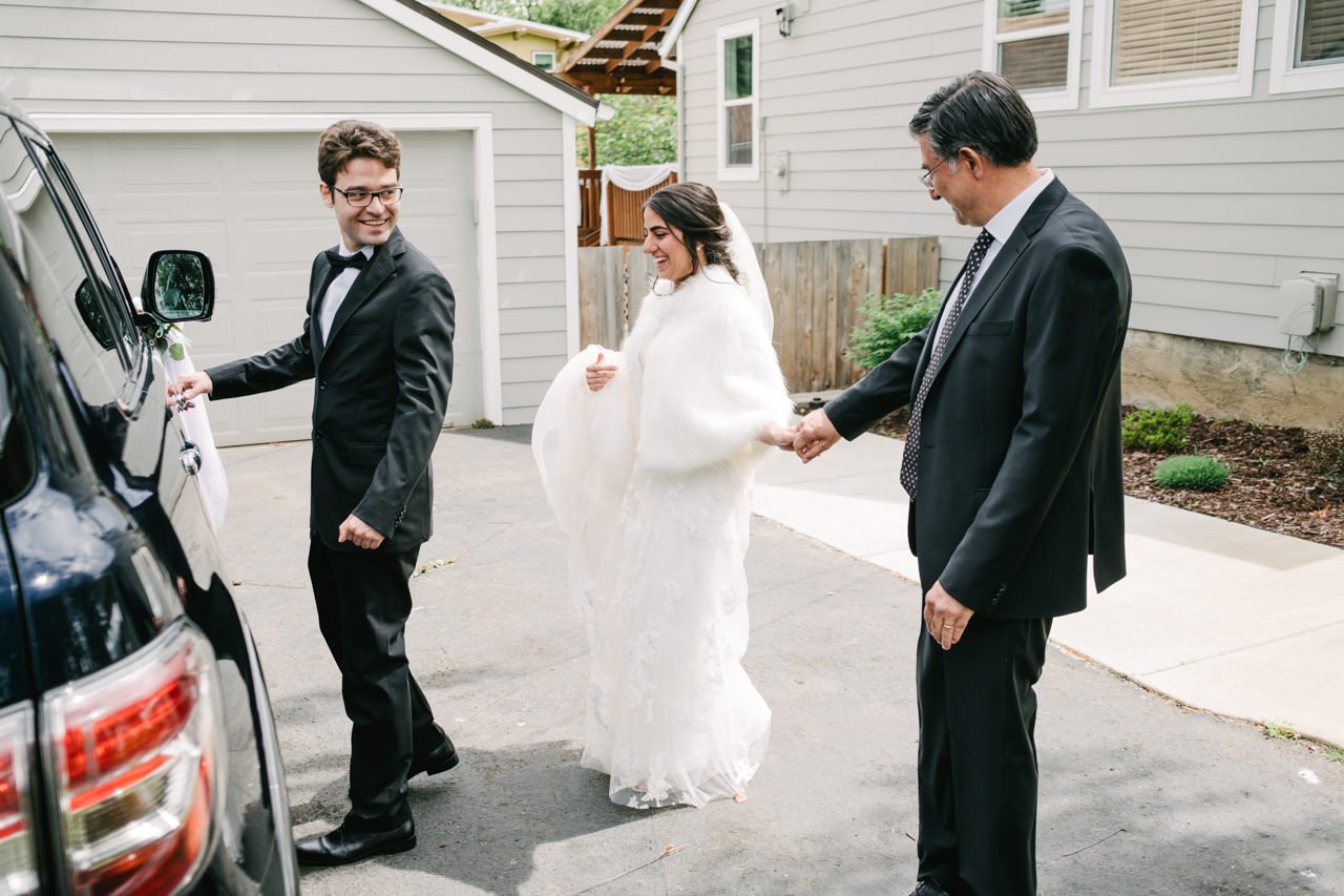  Father and brother open door for bride 