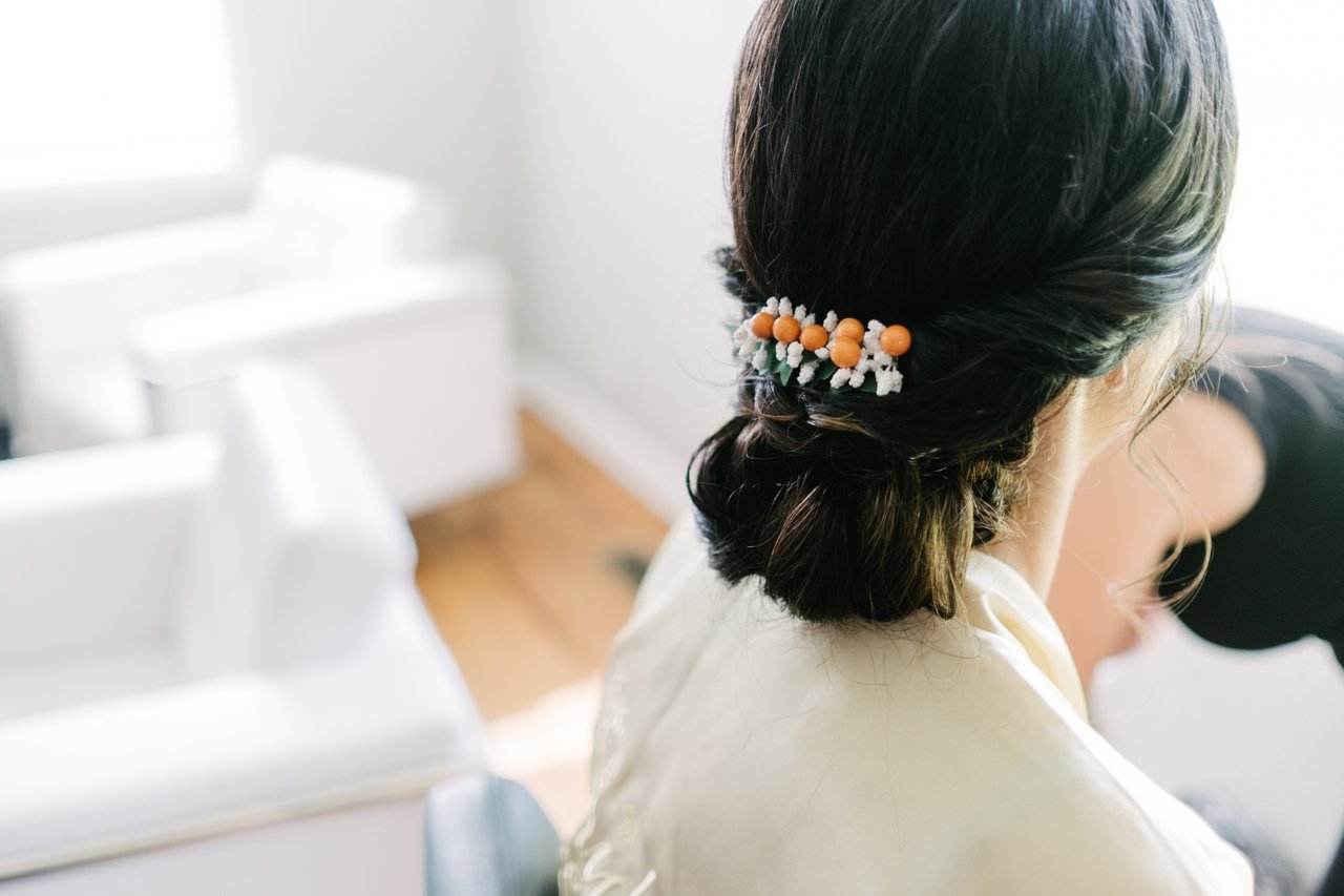  Bride's orange and white hairpiece 