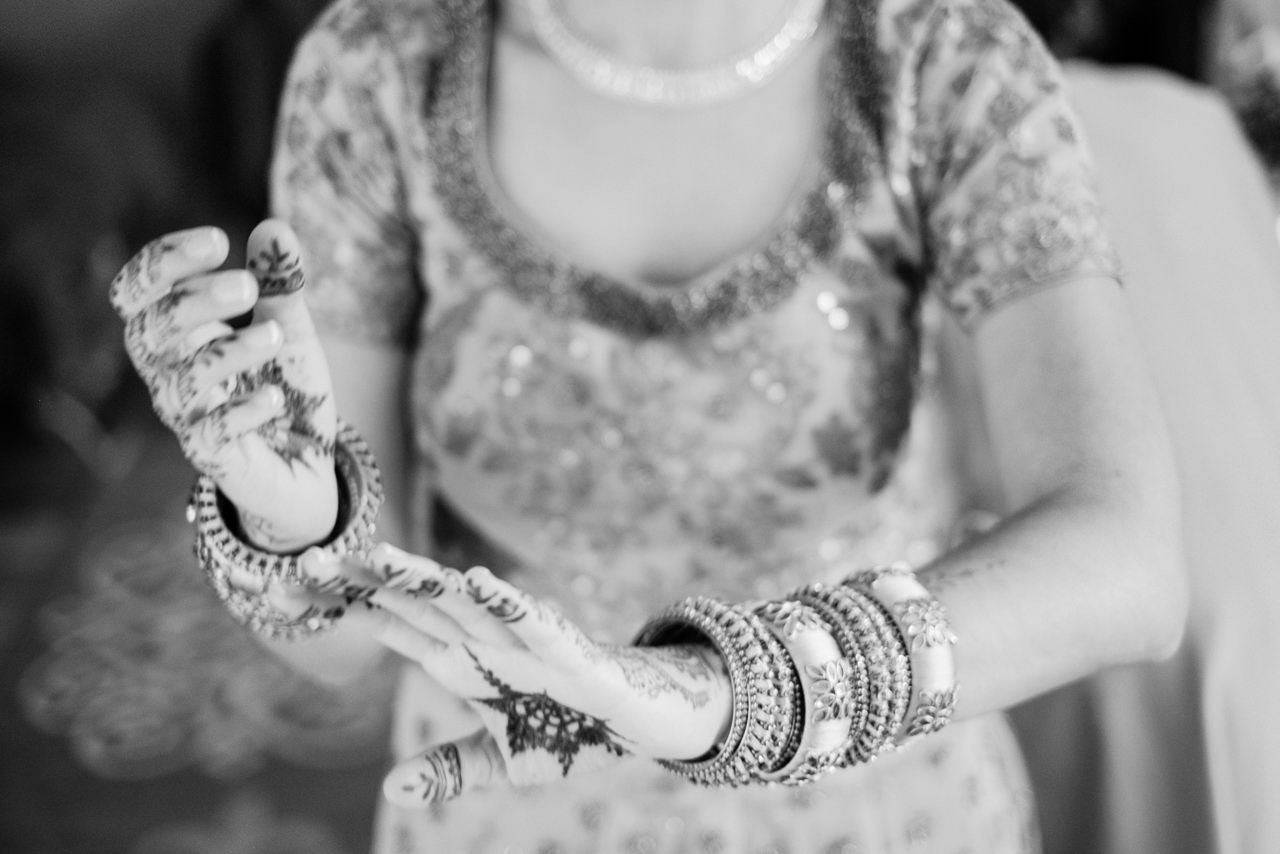  Close up in black and white of bridal henna and bangles 