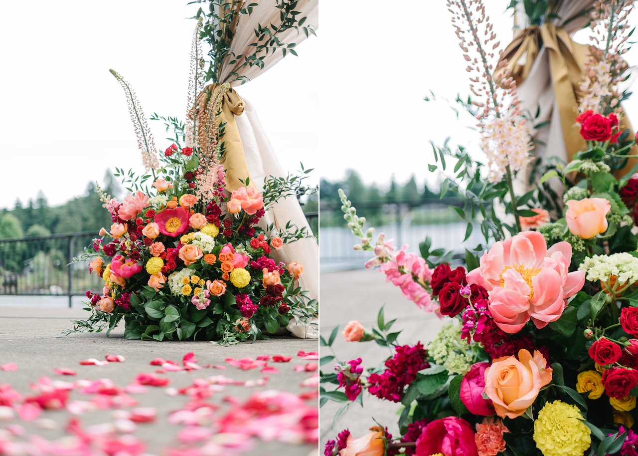  Huge colorful pink orange and red florals at Indian ceremony site 