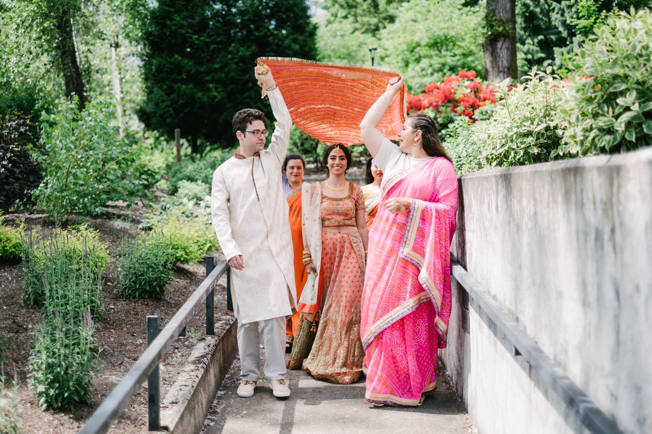  Entrance of Indian bride to ceremony down tight sidewalk 