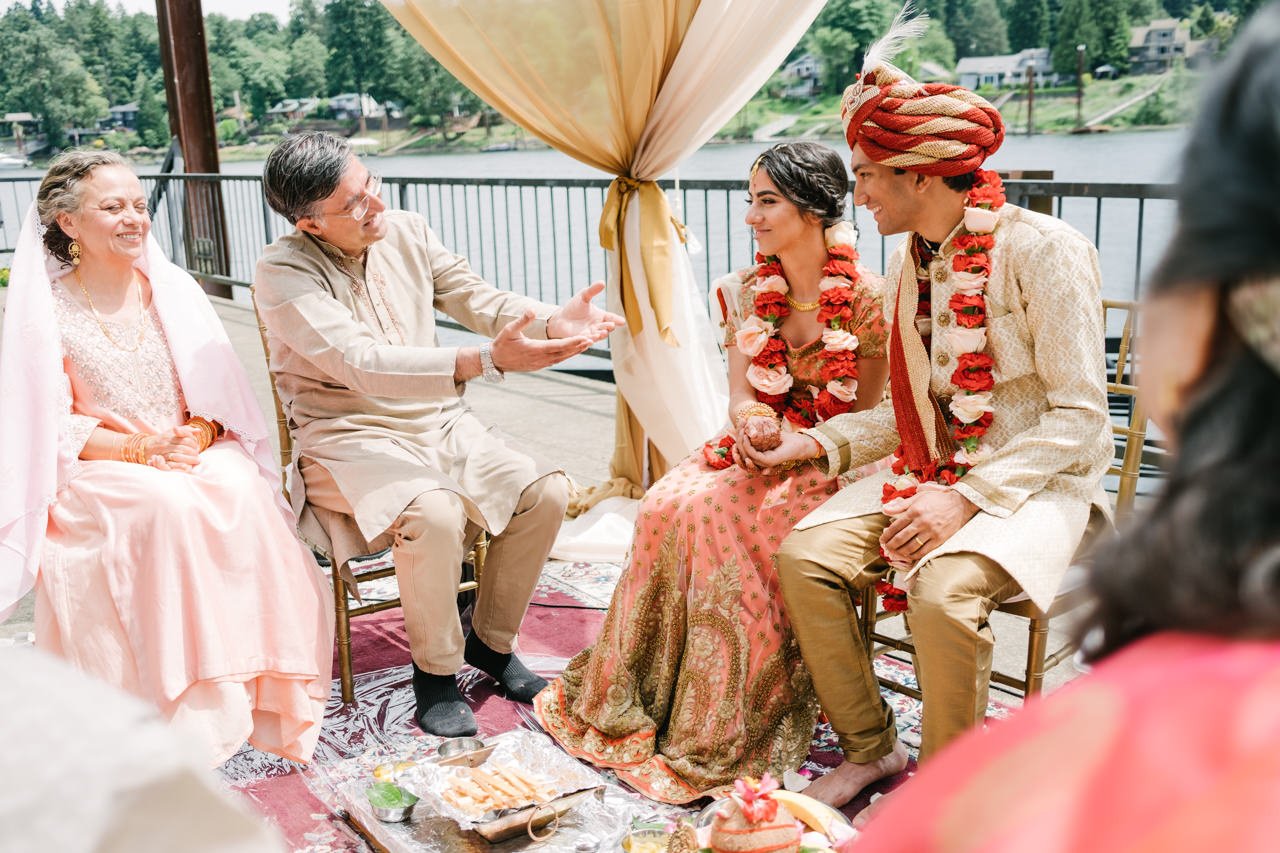  Father of bride offers hands to couple 
