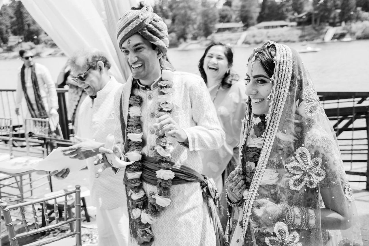  Candid moment of groom and bride laughing after Indian wedding ceremony 