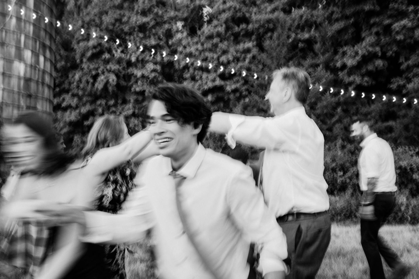  Black and white blurry photos of guests dancing 