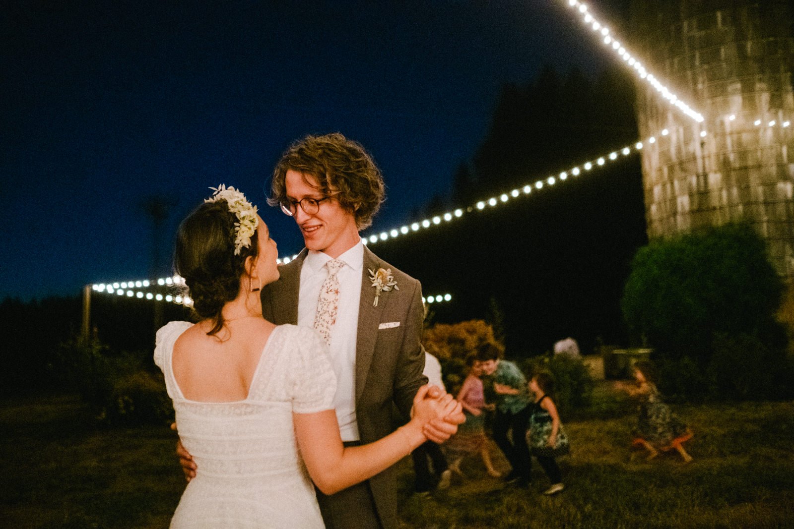 First dance under twinkle lights and farm silo 