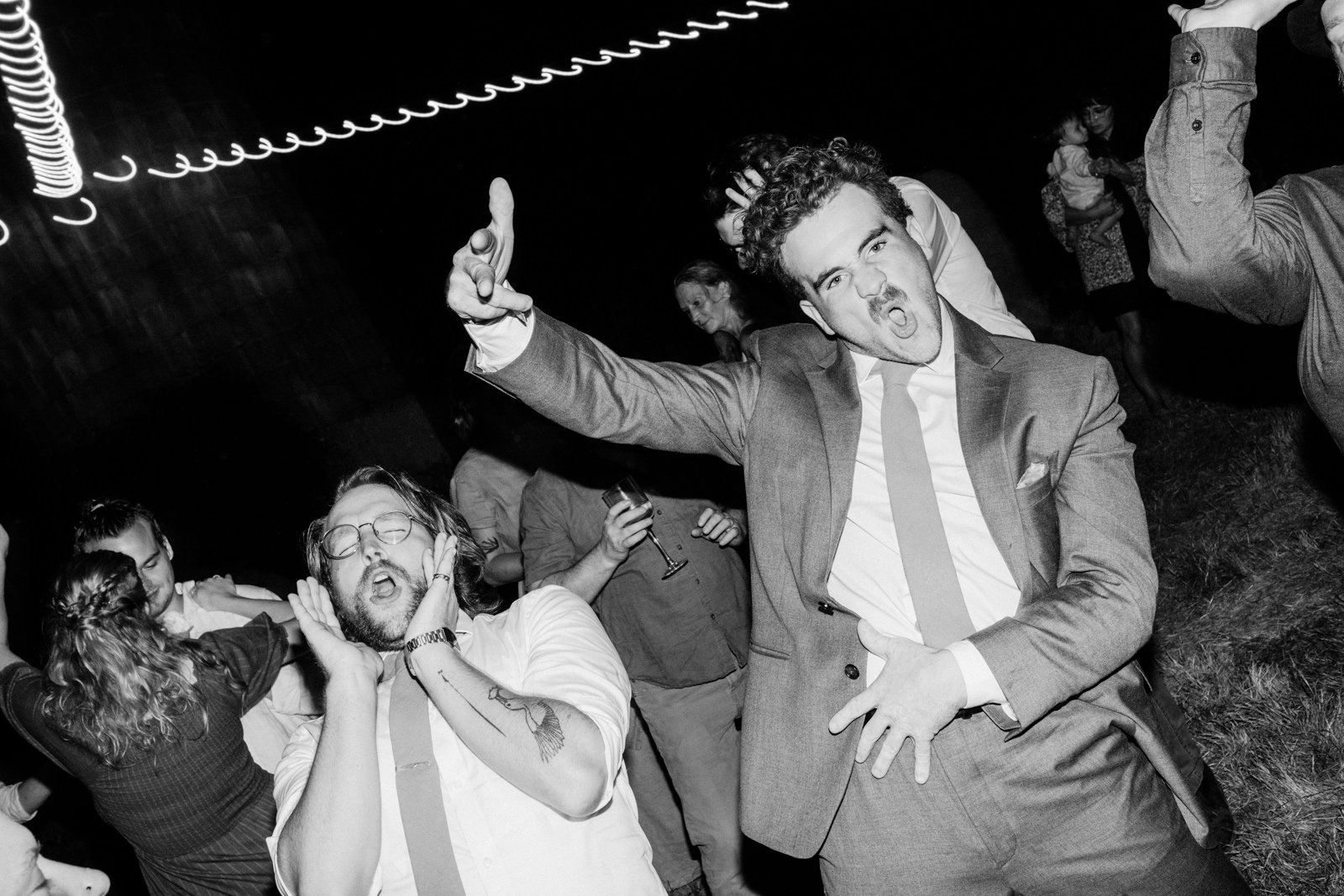  Funny photo of wedding guests dancing and yelling 