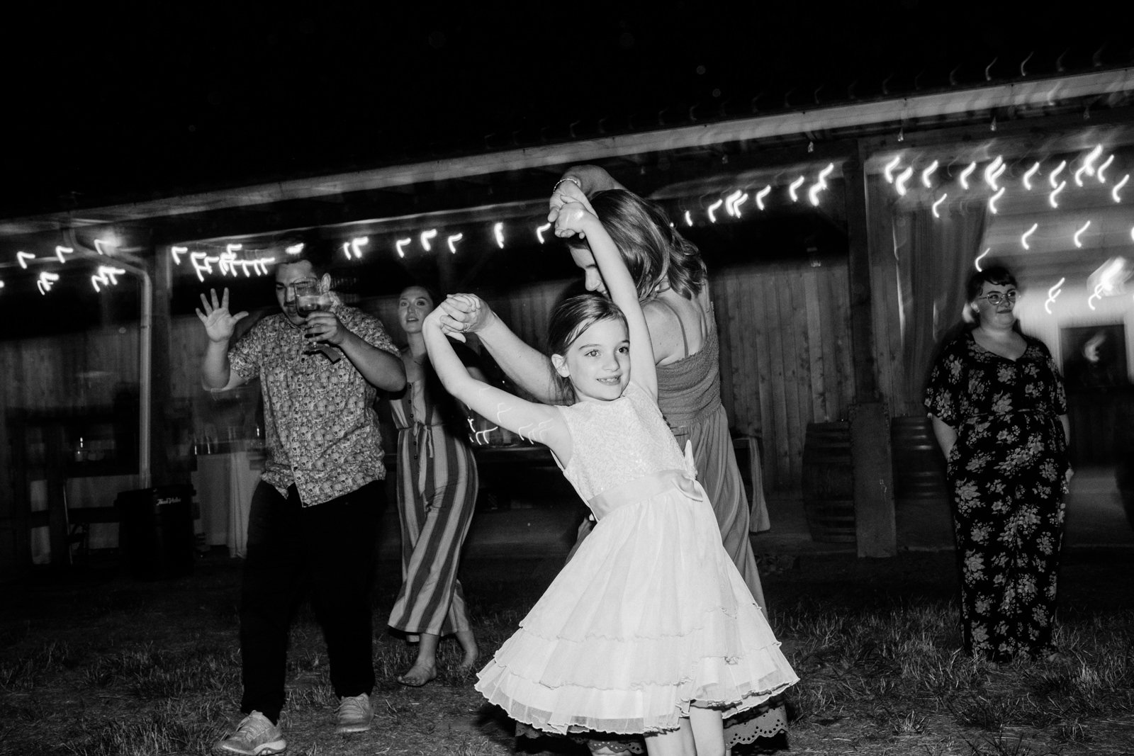  Girl twirls dancing in black and white photo 