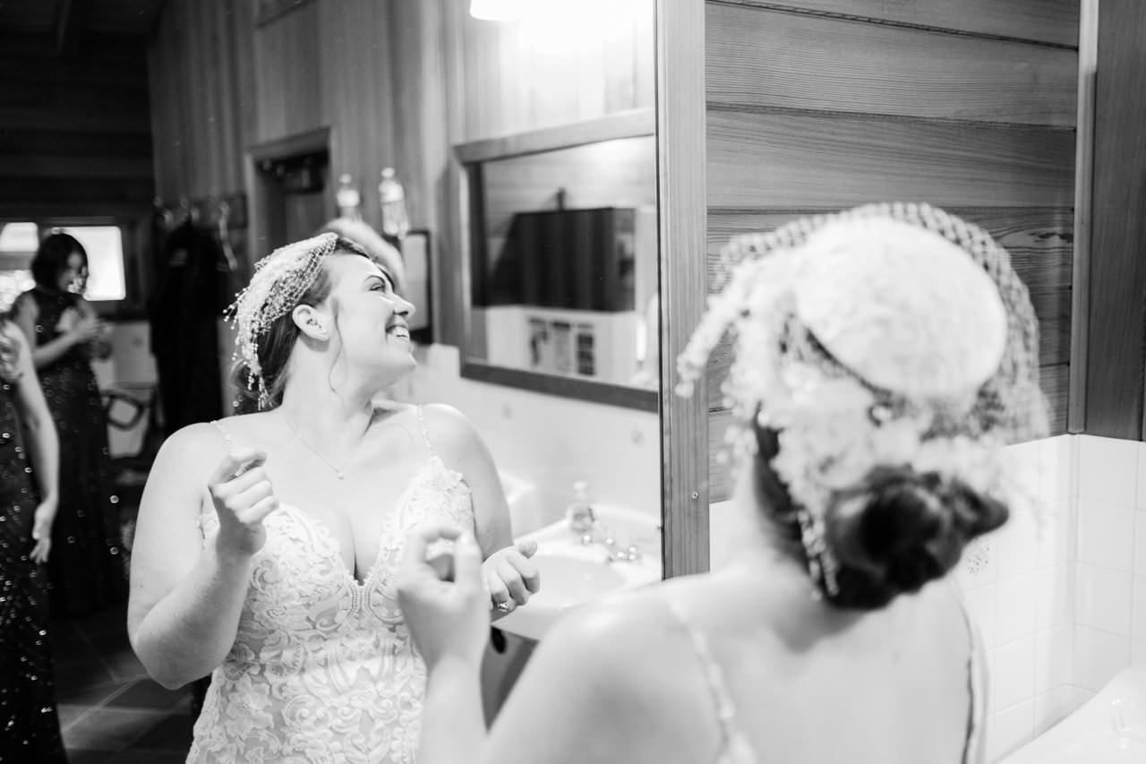 Laughing bride in candid black and white photo 