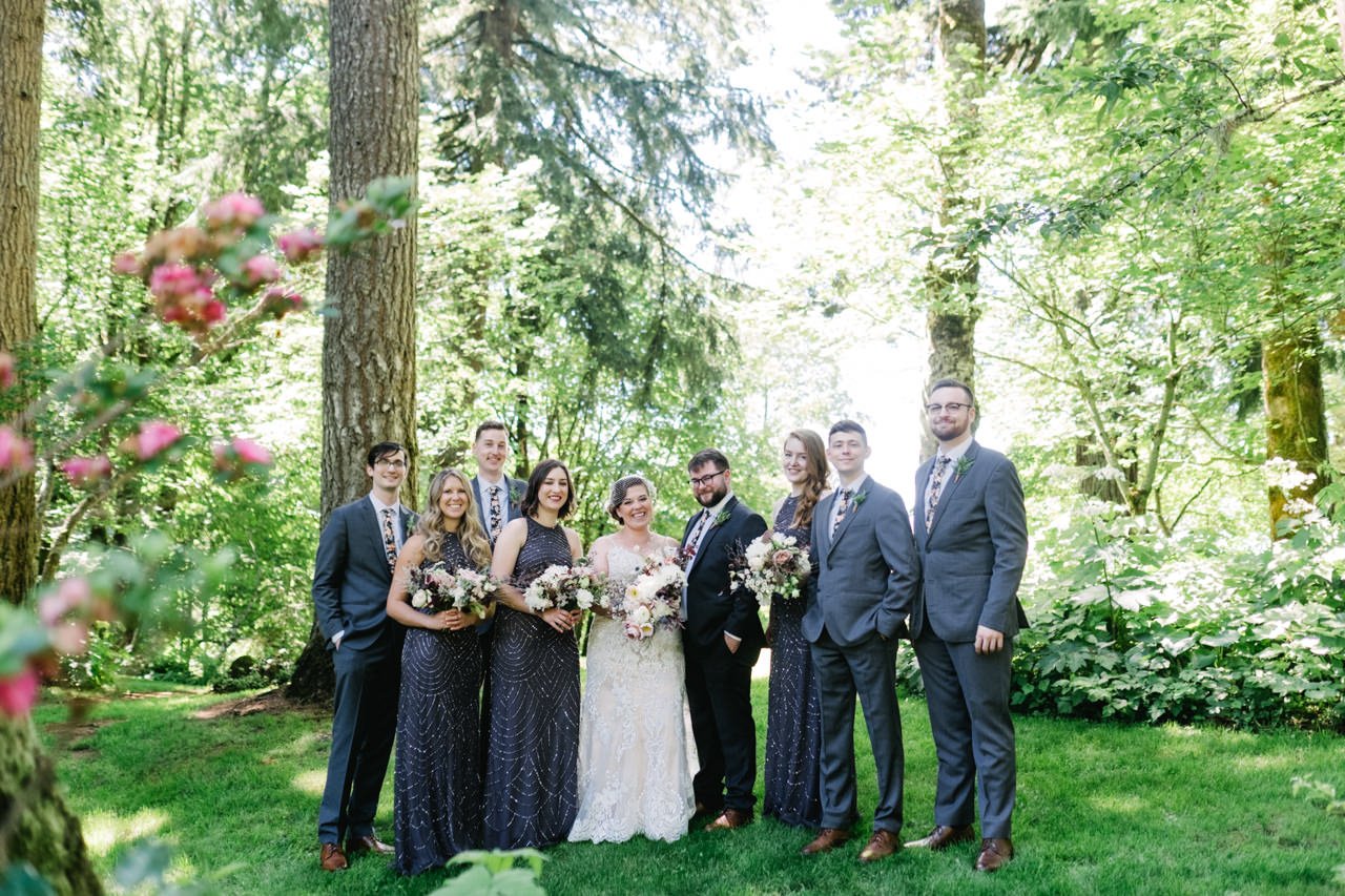  Classic wedding party portrait in tall fir trees and flowers 