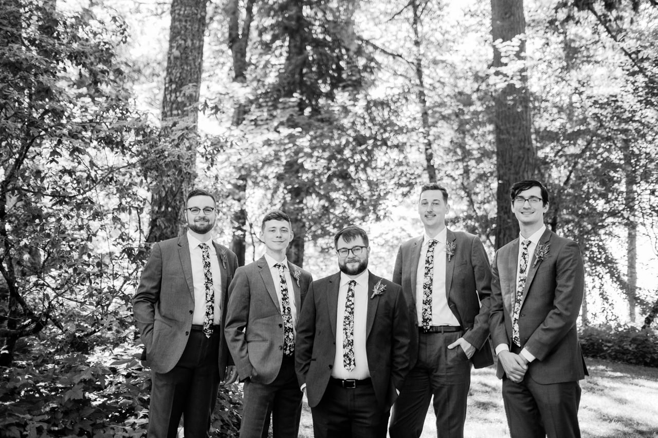  Black and white portrait of groomsmen in floral ties 
