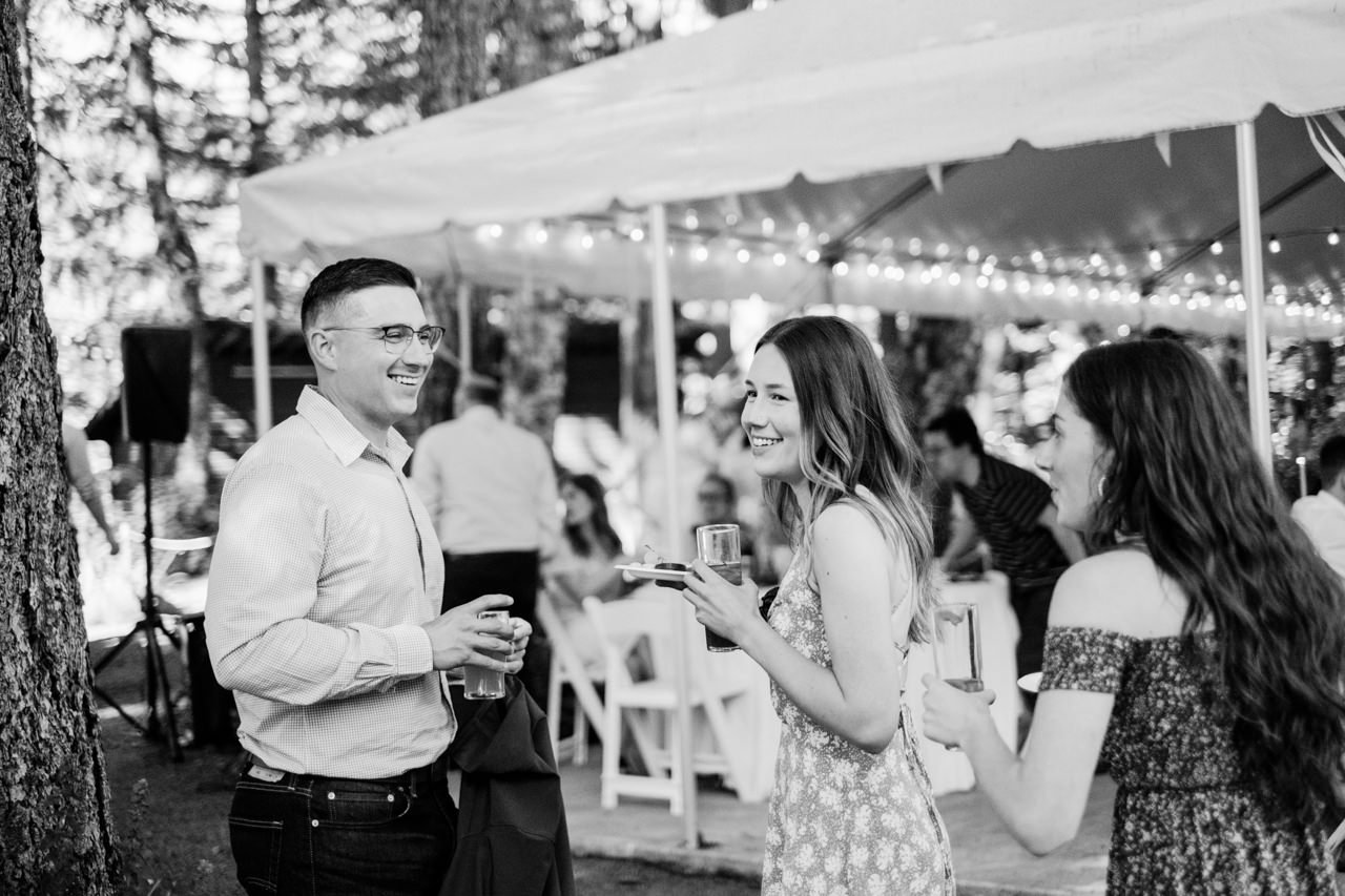  Candid photo of wedding guests smiling in moment 