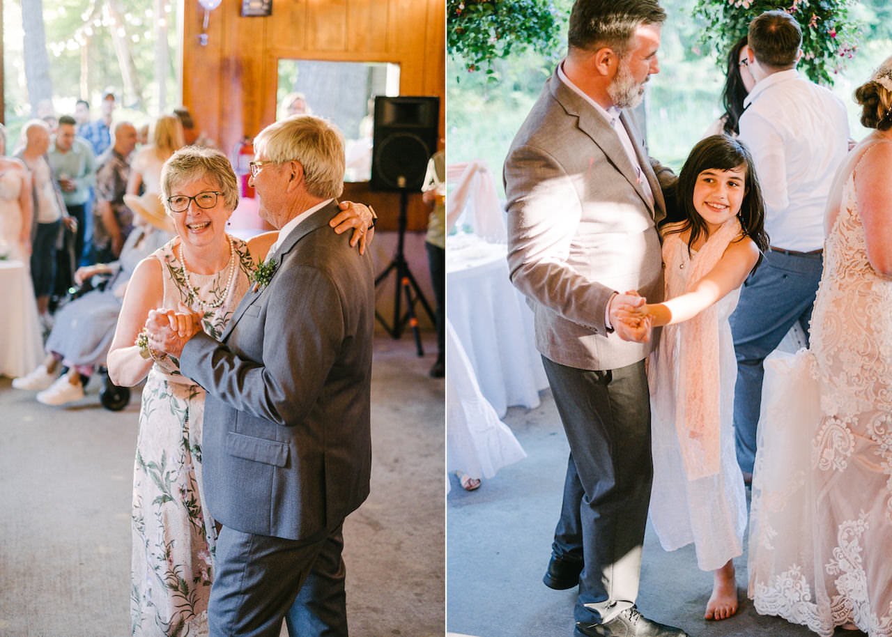  Girl dances with father in sunlight next to bride 