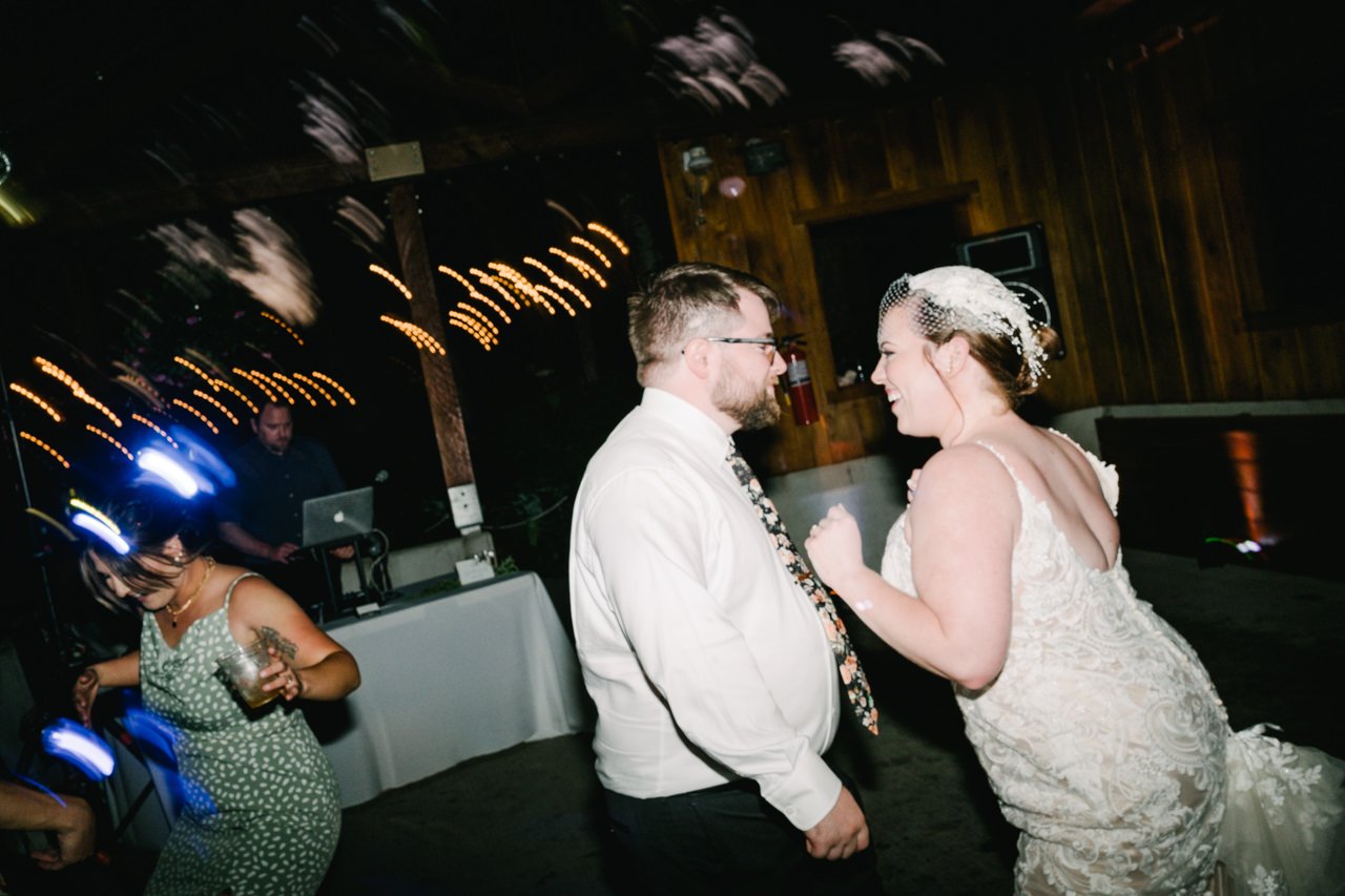  Bride and groom dancing during reception party 