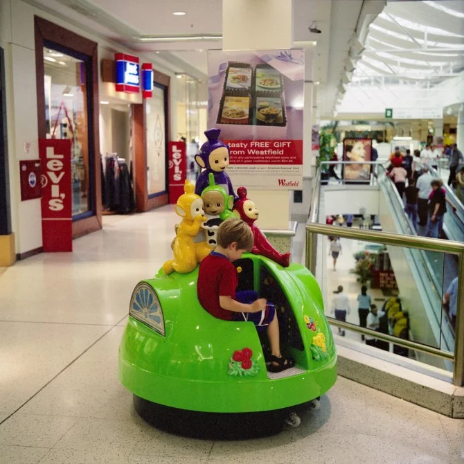 Haruhiko Sameshima - Scene, "Westfield St Lukes Shopping Centre" (child in a Teletubbies ride), 2003