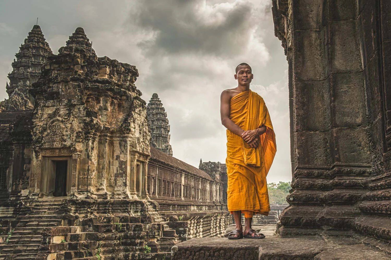 Buddhist Monk outside part of the enormous complex that is Angkor Wat; Nikon D4S, 32mm, f/8, 1/160s, ISO 100