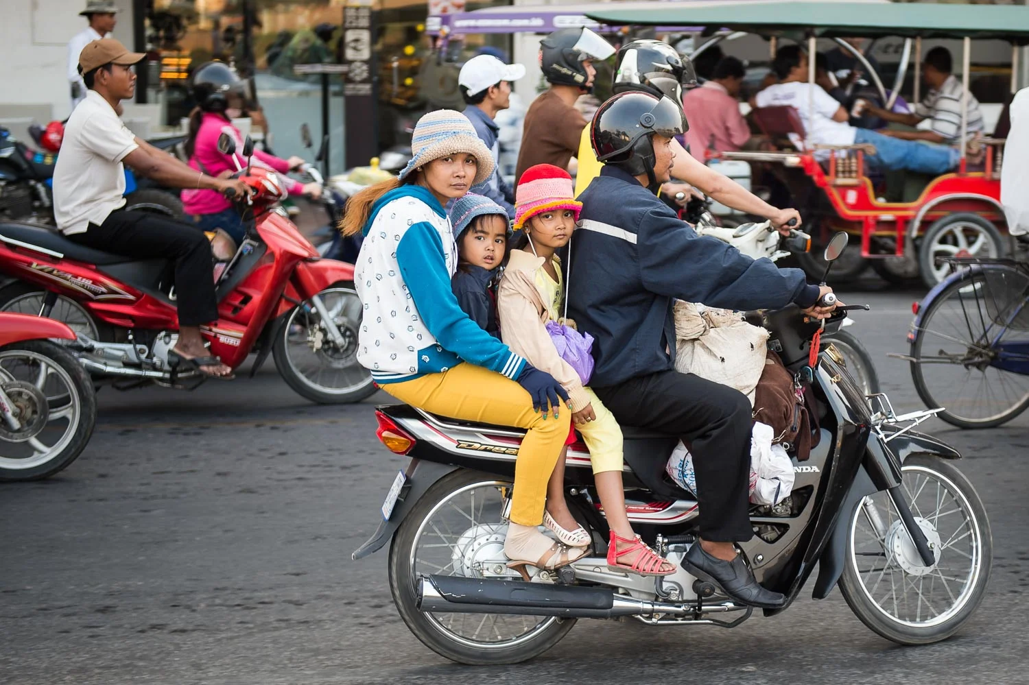 Family on scooter, Phnom Penh; Nikon D4S, 52mm, f/2.8, 1/100s, ISO 110