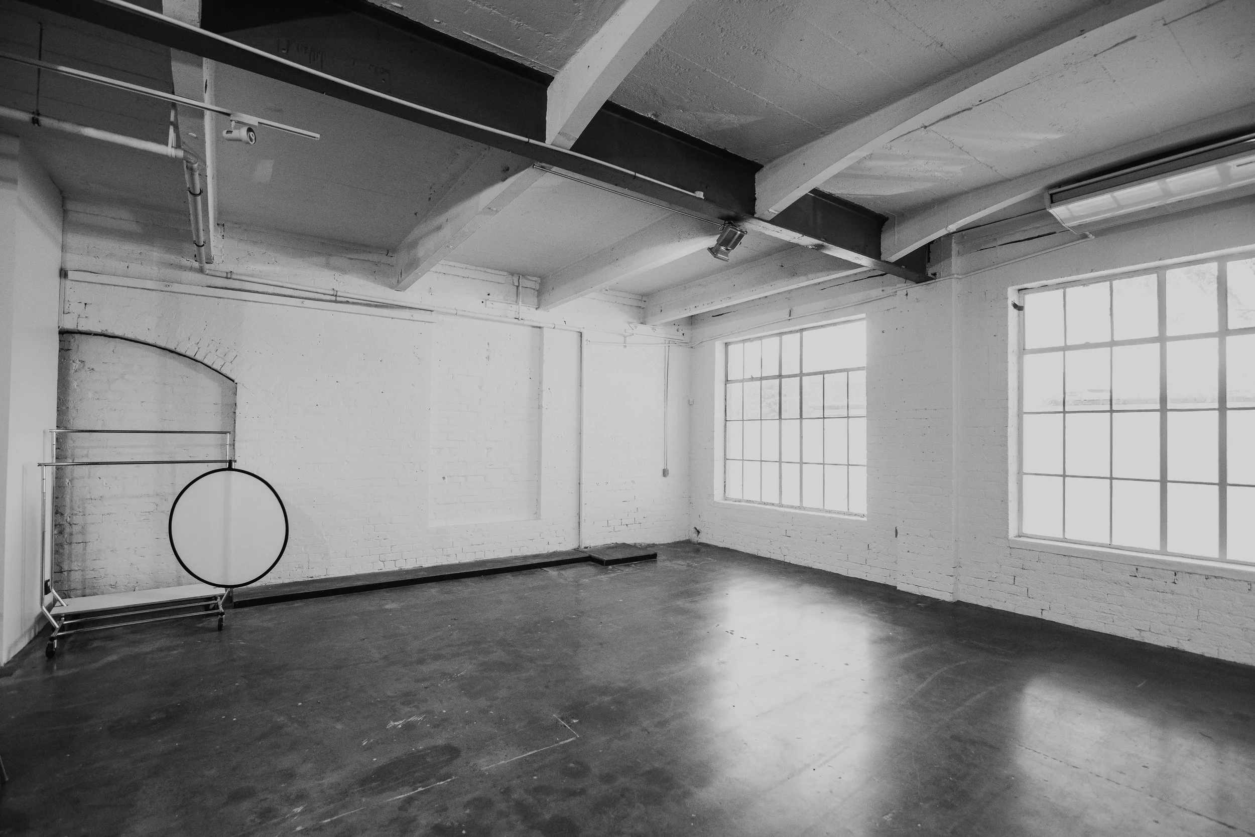 The early 1900s heritage structure offers 3.5-metre stud height, frosted windows for diffuse natural light, and the option of shooting against a blank wall or white-painted brickwork, described as a “blank canvas for your ideas”.