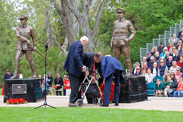 The Tubb family laying their wreath as Col. Leslie Maygar looks on.
